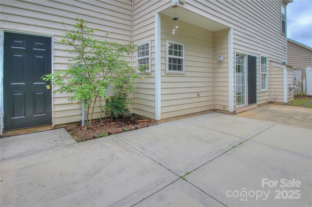 6310 Trevor Simpson Dr, Indian Trail, NC 28079 - view of exterior entry with a patio area