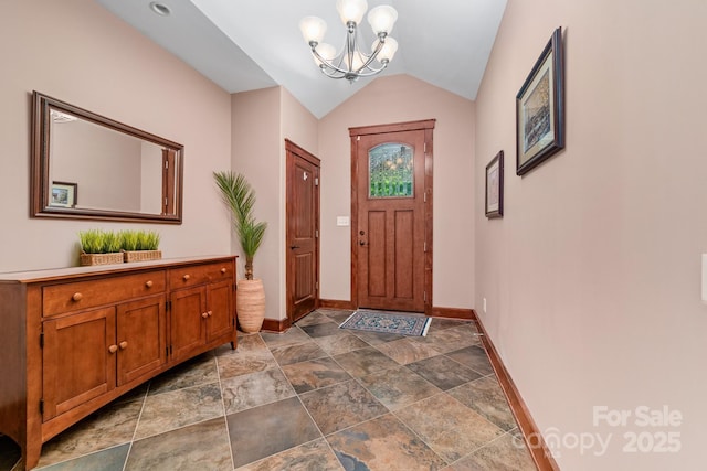 560 Blue Sky Dr, Dallas, NC 28034 - entryway with baseboards, a chandelier, dark stone finish floors, and vaulted ceiling