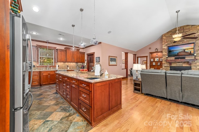 560 Blue Sky Dr, Dallas, NC 28034 - kitchen featuring open floor plan, vaulted ceiling, a sink, brown cabinets, and recessed lighting