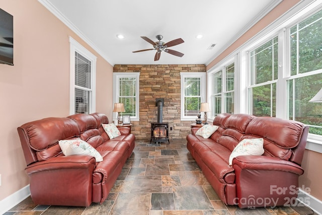 560 Blue Sky Dr, Dallas, NC 28034 - living room featuring a wood stove, a ceiling fan, ornamental molding, stone tile flooring, and baseboards