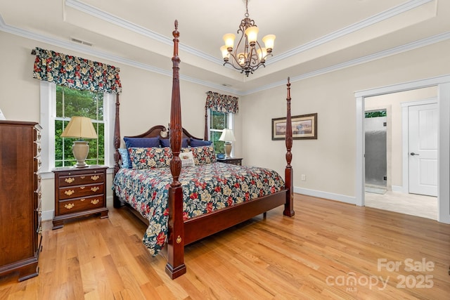 560 Blue Sky Dr, Dallas, NC 28034 - bedroom with a raised ceiling, light wood-style floors, multiple windows, crown molding, and a chandelier
