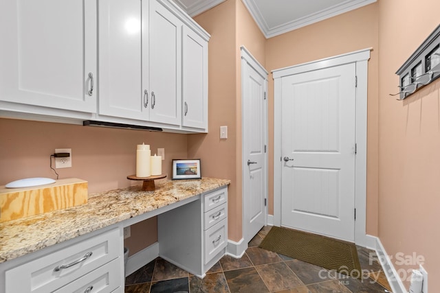 560 Blue Sky Dr, Dallas, NC 28034 - office with built in study area, ornamental molding, baseboards, and dark stone finish floors