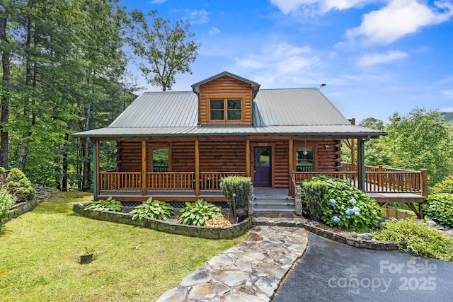 111 Grizzly Den Way, Marion, NC 28752 - cabin with log exterior, covered porch, a front lawn, and metal roof