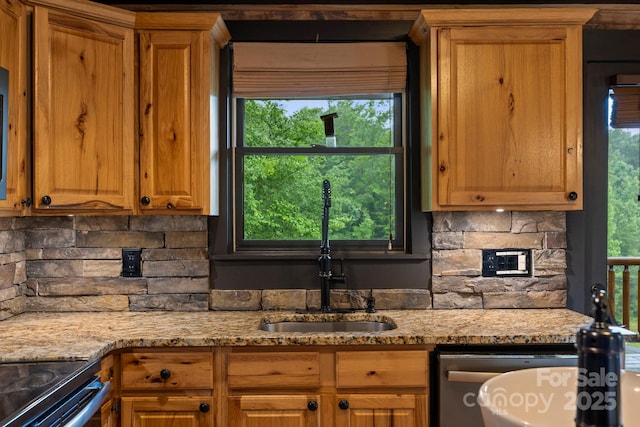 111 Grizzly Den Way, Marion, NC 28752 - kitchen featuring a sink, decorative backsplash, light stone countertops, and a fireplace