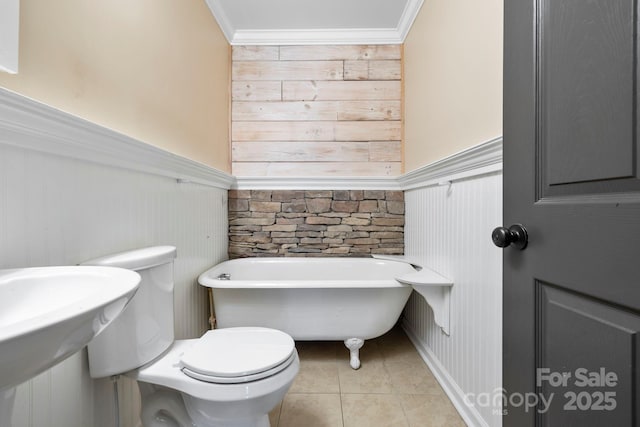 111 Grizzly Den Way, Marion, NC 28752 - full bathroom with a freestanding tub, wainscoting, tile patterned flooring, toilet, and crown molding