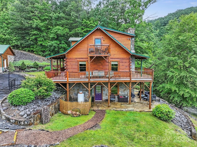 111 Grizzly Den Way, Marion, NC 28752 - view of front of house featuring log exterior, a patio, a balcony, and a front yard