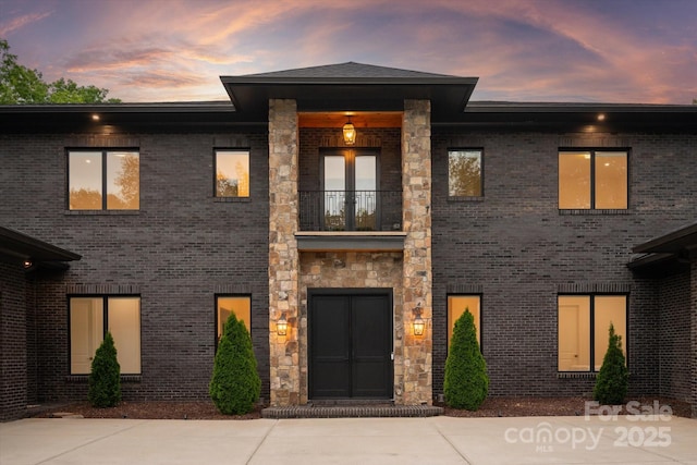 3020 Brooks Mill Ln, Wingate, NC 28174 - view of front facade featuring a balcony and brick siding