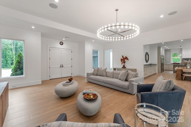 3020 Brooks Mill Ln, Wingate, NC 28174 - living room featuring light wood finished floors, recessed lighting, a chandelier, healthy amount of natural light, and baseboards