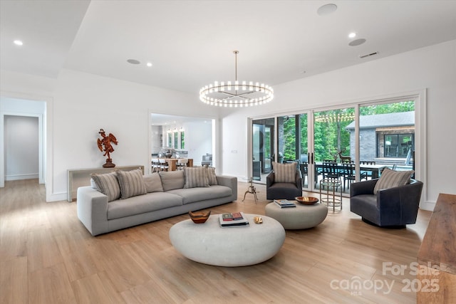 3020 Brooks Mill Ln, Wingate, NC 28174 - living room with a chandelier, light wood-type flooring, baseboards, and recessed lighting