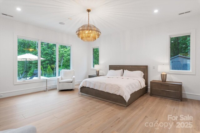 3020 Brooks Mill Ln, Wingate, NC 28174 - bedroom featuring a chandelier, light wood finished floors, baseboards, and recessed lighting