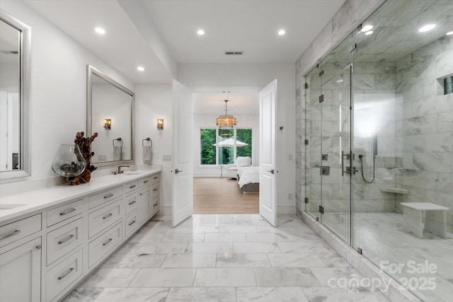 3020 Brooks Mill Ln, Wingate, NC 28174 - ensuite bathroom featuring recessed lighting, double vanity, a marble finish shower, baseboards, and marble finish floors