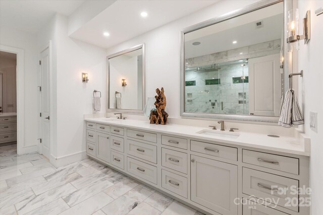 3020 Brooks Mill Ln, Wingate, NC 28174 - full bathroom featuring double vanity, marble look tiles, a stall shower, recessed lighting, and baseboards