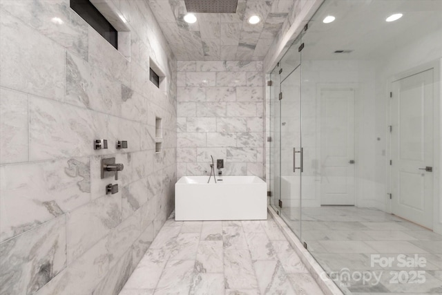 3020 Brooks Mill Ln, Wingate, NC 28174 - full bathroom featuring a stall shower, a soaking tub, recessed lighting, and marble finish flooring