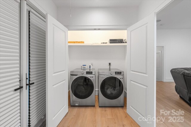 3020 Brooks Mill Ln, Wingate, NC 28174 - washroom featuring washing machine and clothes dryer and light wood finished floors