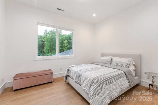 3020 Brooks Mill Ln, Wingate, NC 28174 - bedroom with wood finished floors, recessed lighting, and baseboards