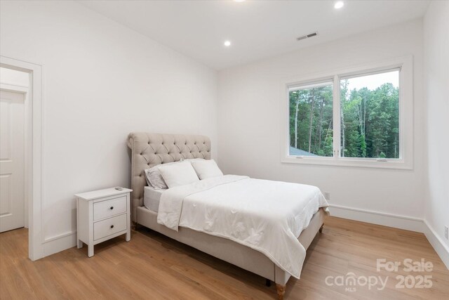 3020 Brooks Mill Ln, Wingate, NC 28174 - bedroom featuring light wood-type flooring, recessed lighting, and baseboards