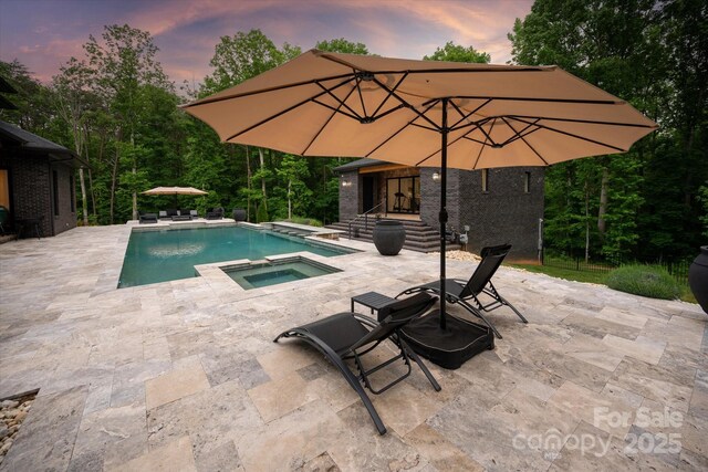 3020 Brooks Mill Ln, Wingate, NC 28174 - view of swimming pool featuring a patio, an outbuilding, and a pool with connected hot tub