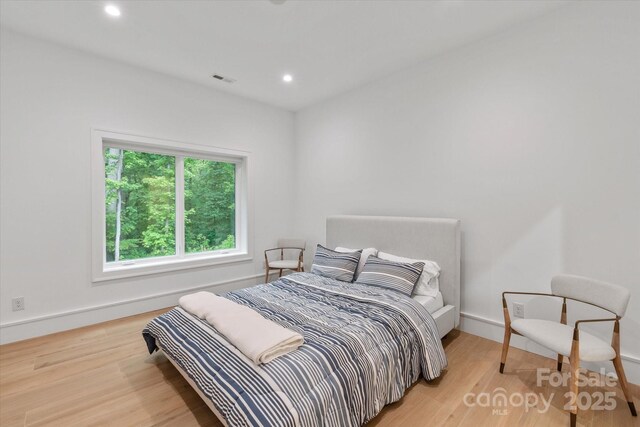 3020 Brooks Mill Ln, Wingate, NC 28174 - bedroom featuring wood finished floors, recessed lighting, and baseboards