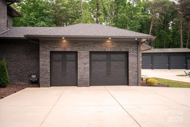 3020 Brooks Mill Ln, Wingate, NC 28174 - garage featuring view of wooded area