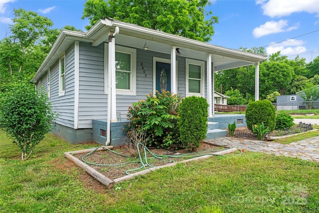 3400 Reid Ave, Charlotte, NC 28208 - view of front of house with covered porch, a front lawn, and crawl space