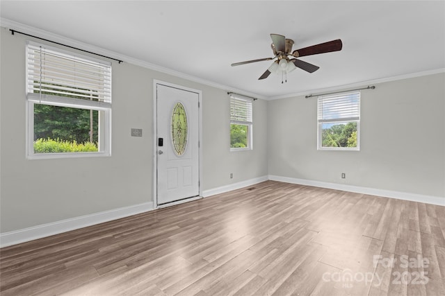 3400 Reid Ave, Charlotte, NC 28208 - entrance foyer with light wood-style floors, ornamental molding, baseboards, and ceiling fan