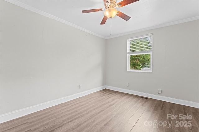 3400 Reid Ave, Charlotte, NC 28208 - spare room featuring wood finished floors, baseboards, ornamental molding, and a ceiling fan