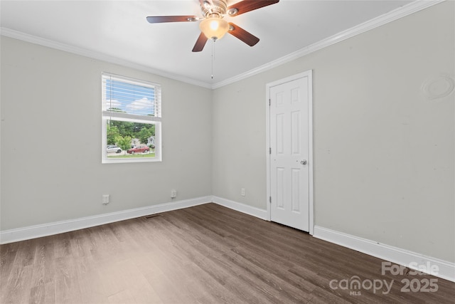 3400 Reid Ave, Charlotte, NC 28208 - unfurnished room featuring dark wood-style flooring, baseboards, a ceiling fan, and crown molding