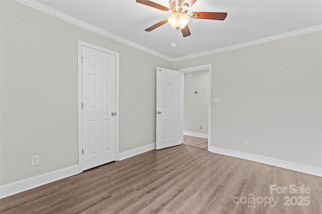 3400 Reid Ave, Charlotte, NC 28208 - unfurnished bedroom with wood finished floors, ornamental molding, baseboards, and ceiling fan