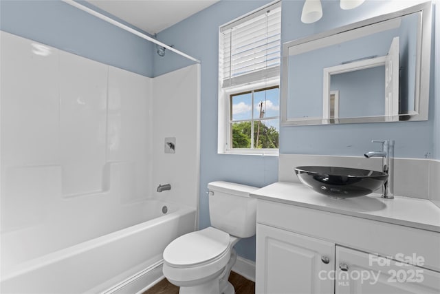3400 Reid Ave, Charlotte, NC 28208 - full bathroom featuring toilet, vanity, shower / bathtub combination, and wood finished floors