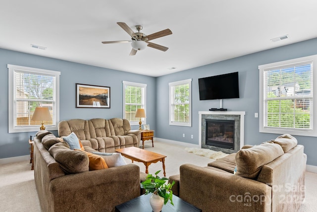 21 Henbit Way, Arden, NC 28704 - living area featuring light colored carpet, baseboards, plenty of natural light, and a fireplace