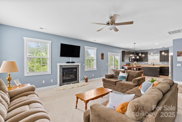 21 Henbit Way, Arden, NC 28704 - living area featuring baseboards, light colored carpet, healthy amount of natural light, a ceiling fan, and recessed lighting
