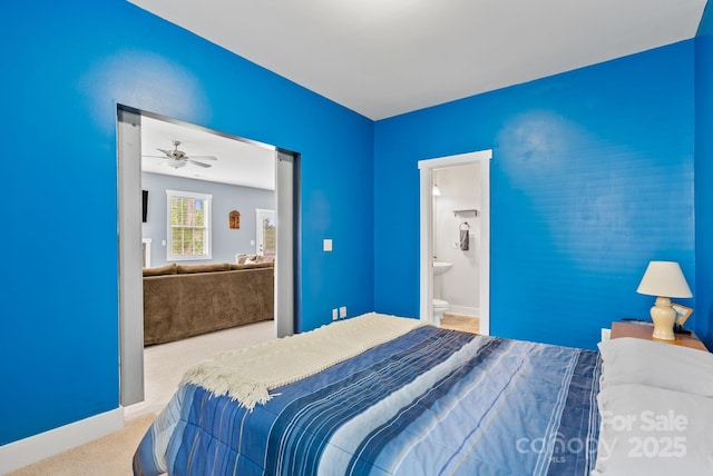21 Henbit Way, Arden, NC 28704 - carpeted bedroom featuring connected bathroom and baseboards