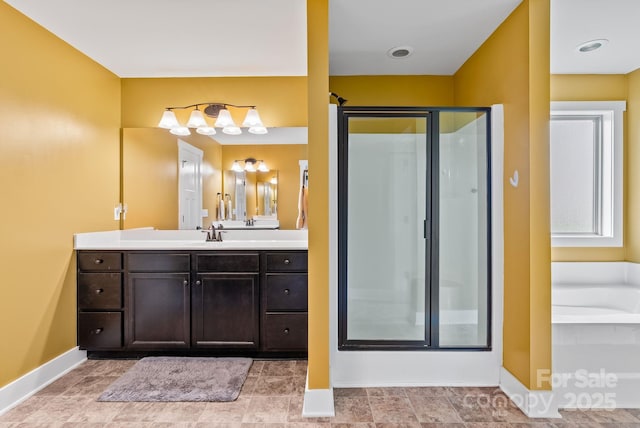 21 Henbit Way, Arden, NC 28704 - full bathroom featuring a shower stall, vanity, baseboards, and a bath