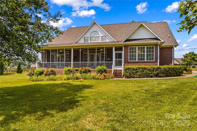 1070 Blueberry Rd, Salisbury, NC 28147 - back of property featuring a sunroom, a lawn, brick siding, and a shingled roof