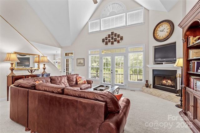 1070 Blueberry Rd, Salisbury, NC 28147 - living room with carpet, a glass covered fireplace, french doors, high vaulted ceiling, and baseboards