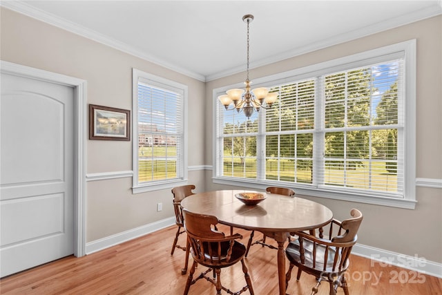 1070 Blueberry Rd, Salisbury, NC 28147 - dining area featuring baseboards, a chandelier, light wood finished floors, and ornamental molding
