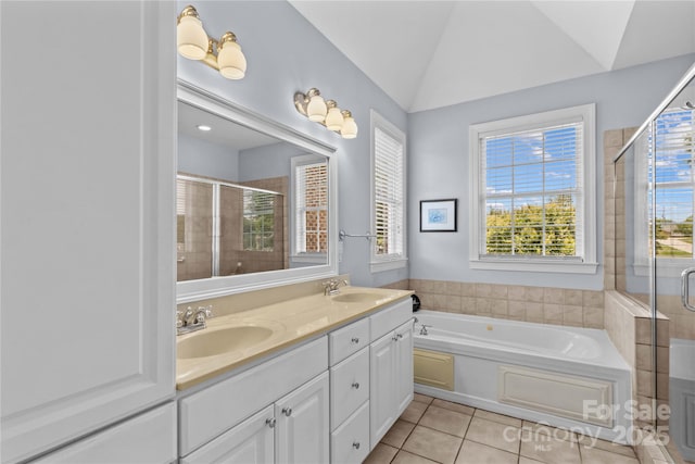 1070 Blueberry Rd, Salisbury, NC 28147 - bathroom with tile patterned floors, a shower stall, a bath, double vanity, and lofted ceiling