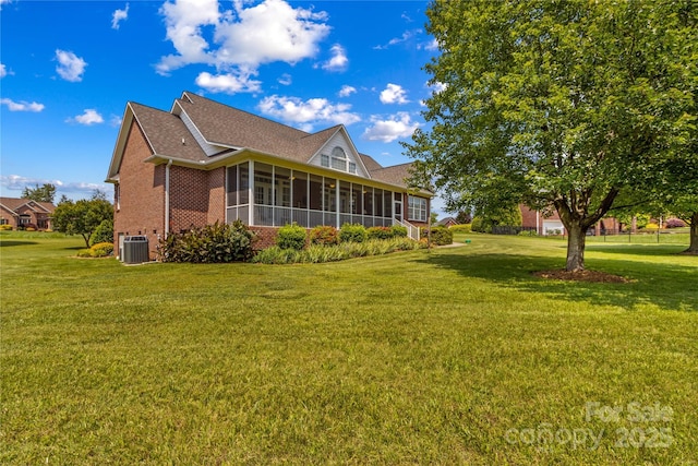 1070 Blueberry Rd, Salisbury, NC 28147 - view of side of home with brick siding, a sunroom, cooling unit, a yard, and a shingled roof