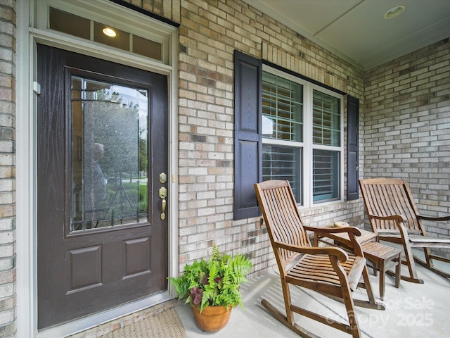 1004 Fairbanks Ct, Indian Trail, NC 28079 - doorway to property featuring a porch and brick siding
