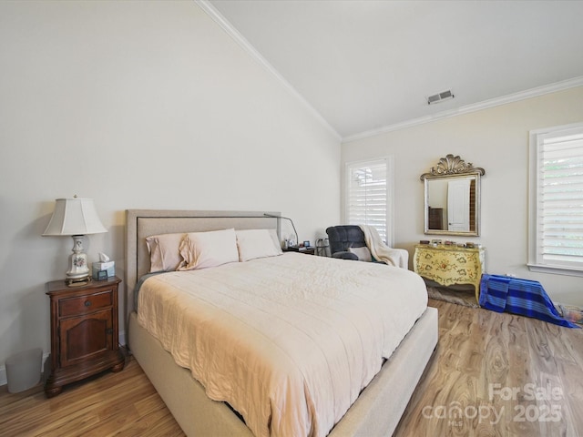1004 Fairbanks Ct, Indian Trail, NC 28079 - bedroom featuring crown molding, vaulted ceiling, wood finished floors, and multiple windows