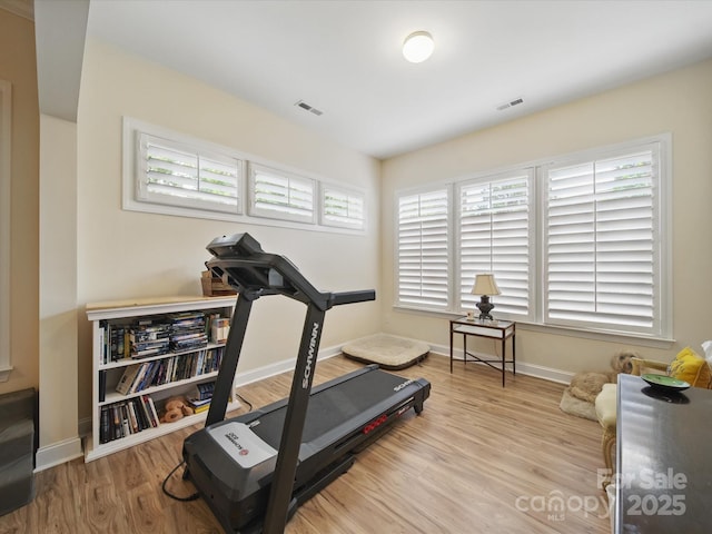 1004 Fairbanks Ct, Indian Trail, NC 28079 - exercise area with plenty of natural light, wood finished floors, and baseboards