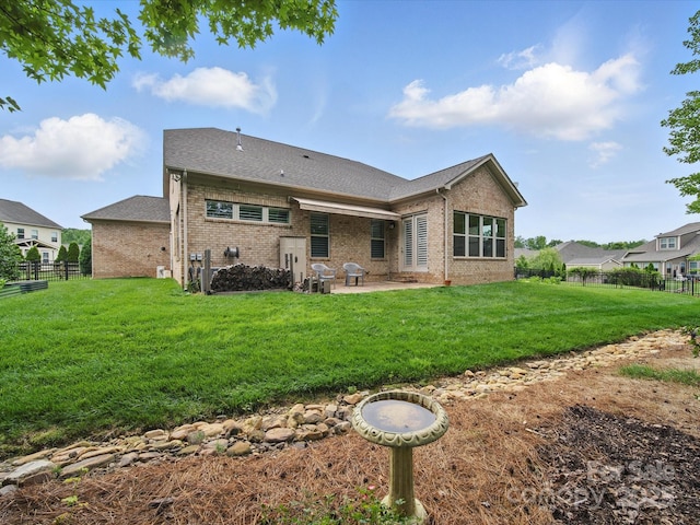 1004 Fairbanks Ct, Indian Trail, NC 28079 - back of house featuring brick siding, a patio, and roof with shingles