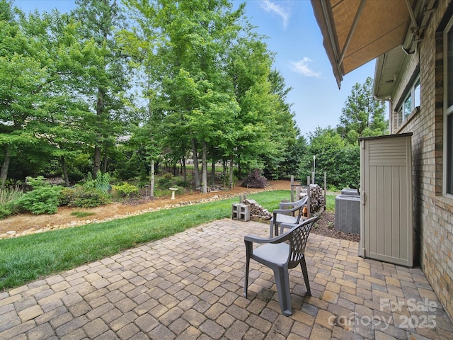 1004 Fairbanks Ct, Indian Trail, NC 28079 - view of patio with central AC unit and view of wooded area