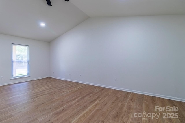 5233 Great Wagon Rd, Charlotte, NC 28215 - spare room featuring vaulted ceiling, wood finished floors, ceiling fan, and baseboards