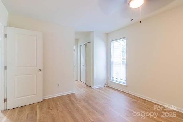 5233 Great Wagon Rd, Charlotte, NC 28215 - empty room with light wood finished floors, baseboards, and ceiling fan