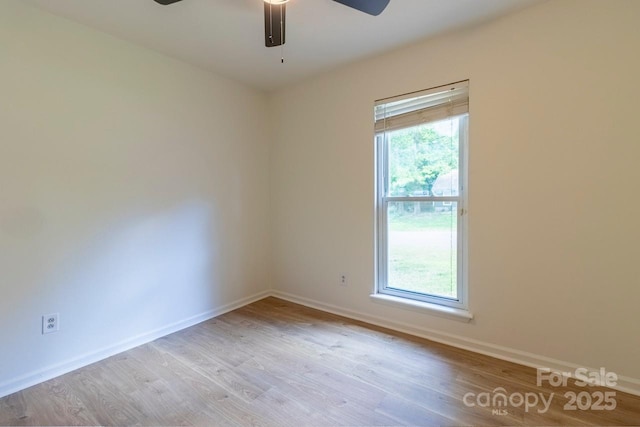5233 Great Wagon Rd, Charlotte, NC 28215 - spare room featuring wood finished floors, baseboards, and a ceiling fan