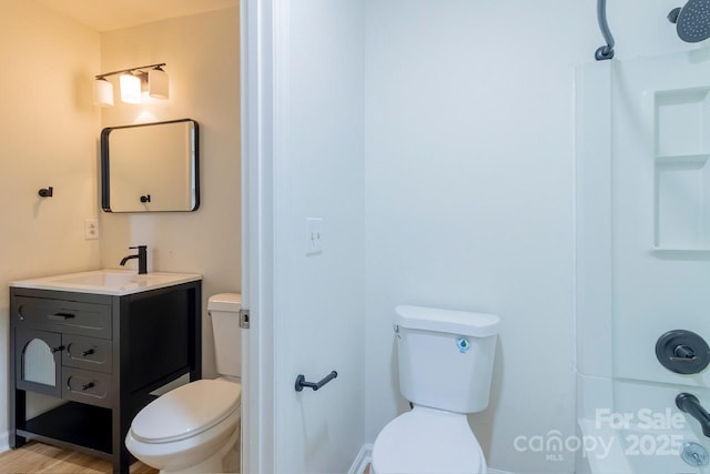 5233 Great Wagon Rd, Charlotte, NC 28215 - full bathroom with toilet, vanity, baseboards, and shower / bath combination