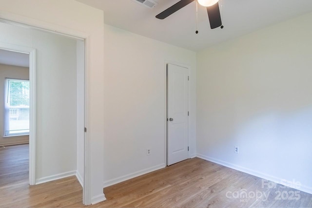 5233 Great Wagon Rd, Charlotte, NC 28215 - unfurnished bedroom featuring light wood-style floors, baseboards, and a ceiling fan