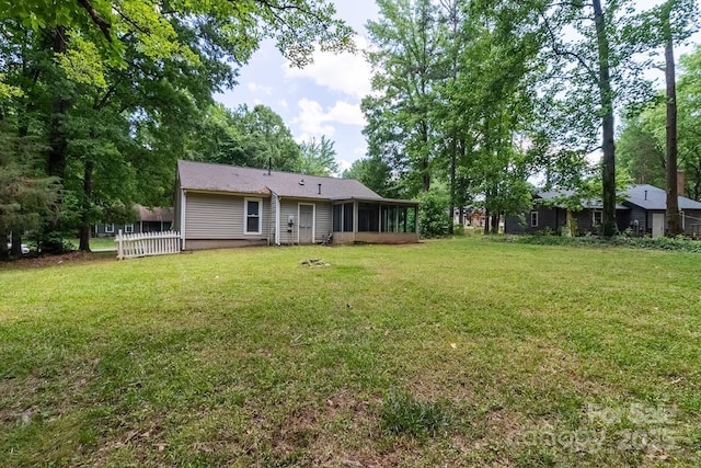 5233 Great Wagon Rd, Charlotte, NC 28215 - rear view of house with a sunroom and a lawn