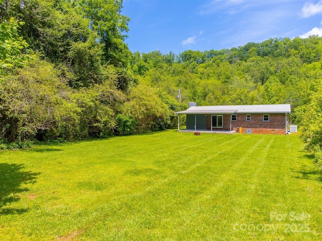 285 Painter Rd S, Cullowhee, NC 28723 - view of green lawn with a view of trees and a patio